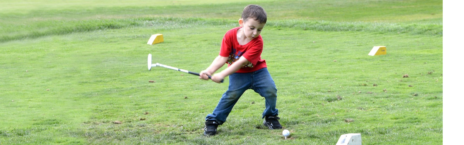 image of child golfing